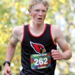 Kenai Central's Chase Laker clears an incline during the boys varsity race of the Wasilla Trailblazer Invite on Friday, Sept. 13, in Wasilla, Alaska. (Photo by Jeremiah Bartz/Frontiersman)