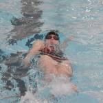 Kenai Centrals Lucy Anderson competes in the 100-yard backstroke at the Kenai Invitational on Saturday, Sept. 21, 2024, at Kenai Central High School in Kenai, Alaska. (Photo by Jeff Helminiak/Peninsula Clarion)