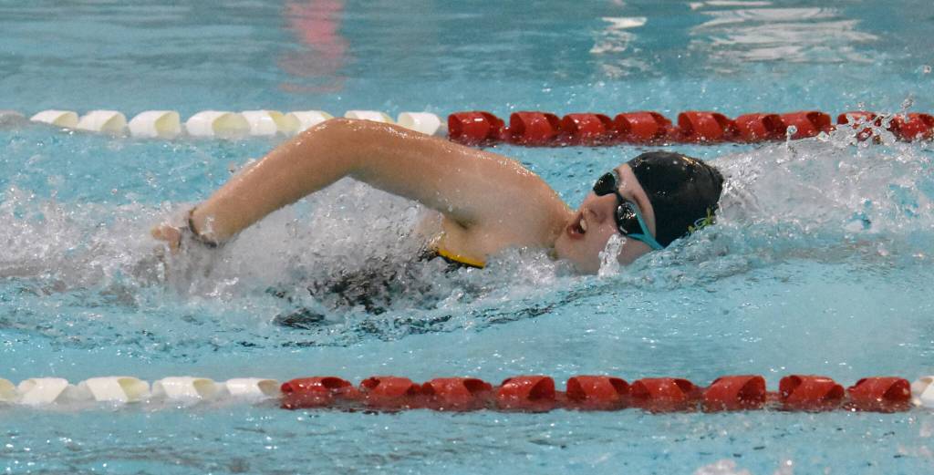 Homers Avery Briscoe competes in the 400-yard freestyle relay at the Kenai Invitational on Saturday, Sept. 21, 2024, at Kenai Central High School in Kenai, Alaska. (Photo by Jeff Helminiak/Peninsula Clarion)
