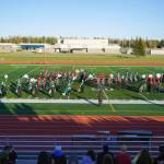 Colony High School marching band, Thee Northern Sound, Kenai Central High School Marching Band, and Soldotna High School Drumline together play Chappell Roans HOT TO GO! during the Kenai Marching Showcase at Ed Hollier Field in Kenai, Alaska, on Saturday, Sept. 21, 2024. (Jake Dye/Peninsula Clarion)