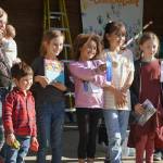 Youth winners of the Harvest Moon Local Food Festivals pie contest stand with their awards at Soldotna Creek Park in Soldotna, Alaska, on Saturday, Sept. 21, 2024. From left: second-place Jesse Fiona and Atlas Ohn-Bar; first-place Adam and Megan Johnson; and third-place Juniper Goodman. (Jake Dye/Peninsula Clarion)