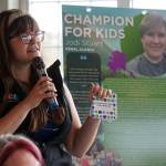 Alaska Childrens Trust Director of Community Engagement Kaila Pfister recognizes Jodi Stuart as a Champion for Kids during a meeting of the Soldotna Rotary Club at Addie Camp in Soldotna, Alaska, on Thursday, Sept. 26, 2024. (Jake Dye/Peninsula Clarion)