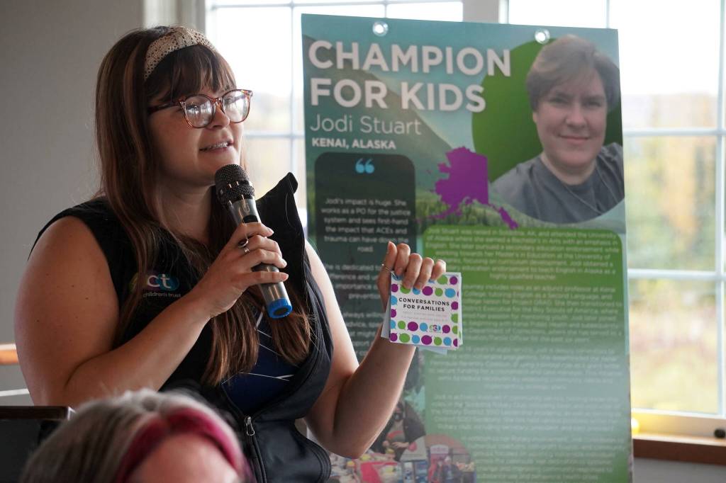 Alaska Childrens Trust Director of Community Engagement Kaila Pfister recognizes Jodi Stuart as a Champion for Kids during a meeting of the Soldotna Rotary Club at Addie Camp in Soldotna, Alaska, on Thursday, Sept. 26, 2024. (Jake Dye/Peninsula Clarion)