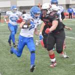 Kodiaks Kaden Hill runs against Kenai Centrals Makai Johansen on Saturday, Sept. 28, 2024, at Ed Hollier Field at Kenai Central High School in Kenai, Alaska. (Photo by Jeff Helminiak/Peninsula Clarion)