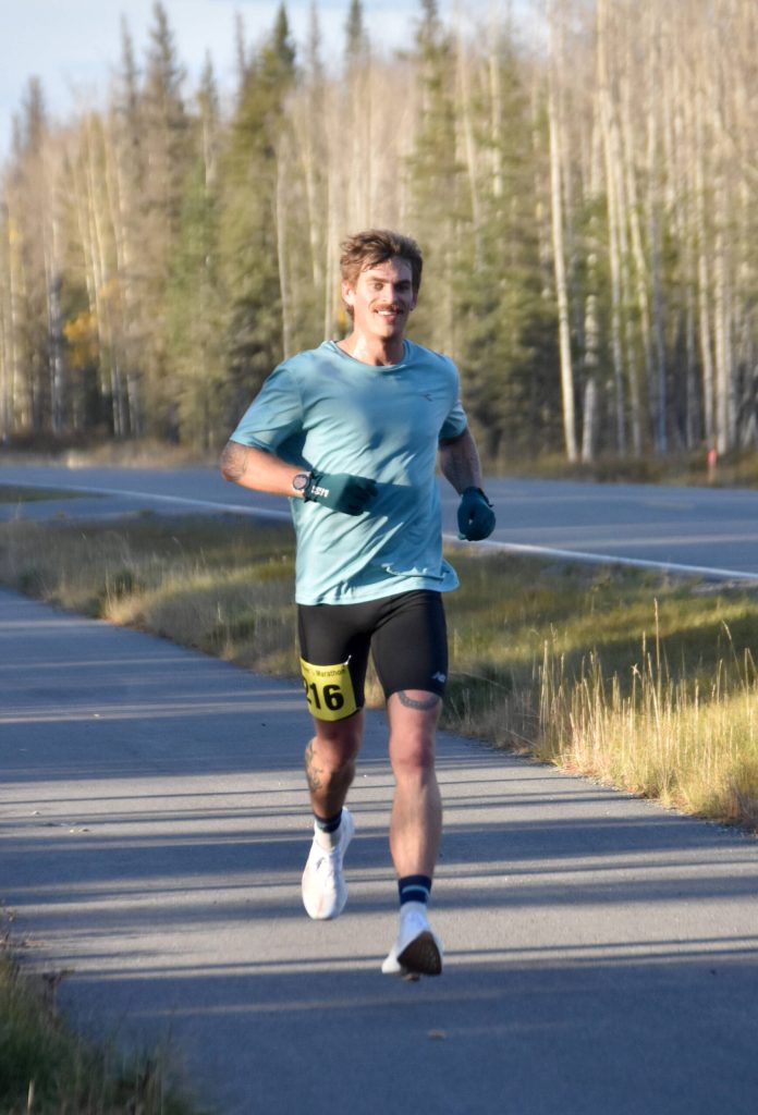 Anchorages Micah Templin runs to victory in the mens half marathon at the Kenai River Marathon on Sunday, Sept. 29, 2024, in Kenai, Alaska. (Photo by Jeff Helminiak/Peninsula Clarion)
