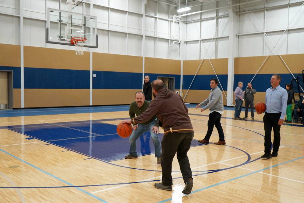 Alaska Christian College staff put in some time on the basketball court during a dedication ceremony for the colleges new athletic center at Alaska Christian College in Soldotna, Alaska, on Friday, Sept. 27, 2024. (Jake Dye/Peninsula Clarion)