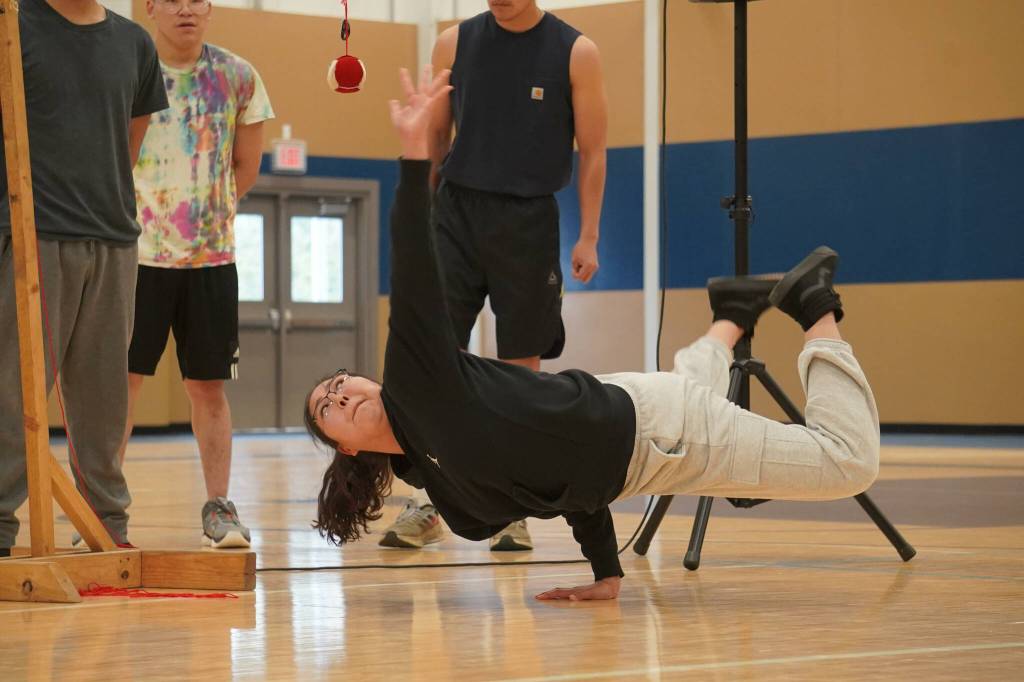 Alaska Christian College students perform a demonstration of Native Youth Olympics during a dedication ceremony for the colleges new athletic center at Alaska Christian College in Soldotna, Alaska, on Friday, Sept. 27, 2024. (Jake Dye/Peninsula Clarion)