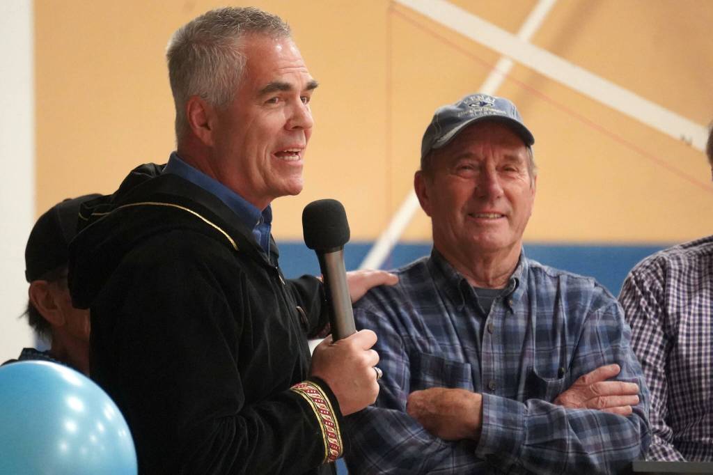 Alaska Christian College President Keith Hamilton recognizes Dennis Schnicke for his contributions to the construction of the colleges new athletic center at a dedication ceremony for the facility at Alaska Christian College in Soldotna, Alaska, on Friday, Sept. 27, 2024. (Jake Dye/Peninsula Clarion)