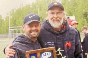 Kenai Central head coach Dan Verkuilen and assistant Brad Nyquist celebrate winning the Division II girls state soccer title Saturday, May 25, 2024, in Wasilla, Alaska. (Photo provided)