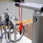 A bike rack and repair station are seen outside of the Kenai Community Library in Kenai, Alaska, on Thursday, Oct. 3, 2024. (Jake Dye/Peninsula Clarion)