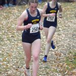 Homers Claira Booz leads Beatrix McDonough in the Division II girls race at the state cross-country running meet on Saturday, Oct. 5, 2024, at Bartlett High School in Anchorage, Alaska. (Photo by Jeff Helminiak/Peninsula Clarion)