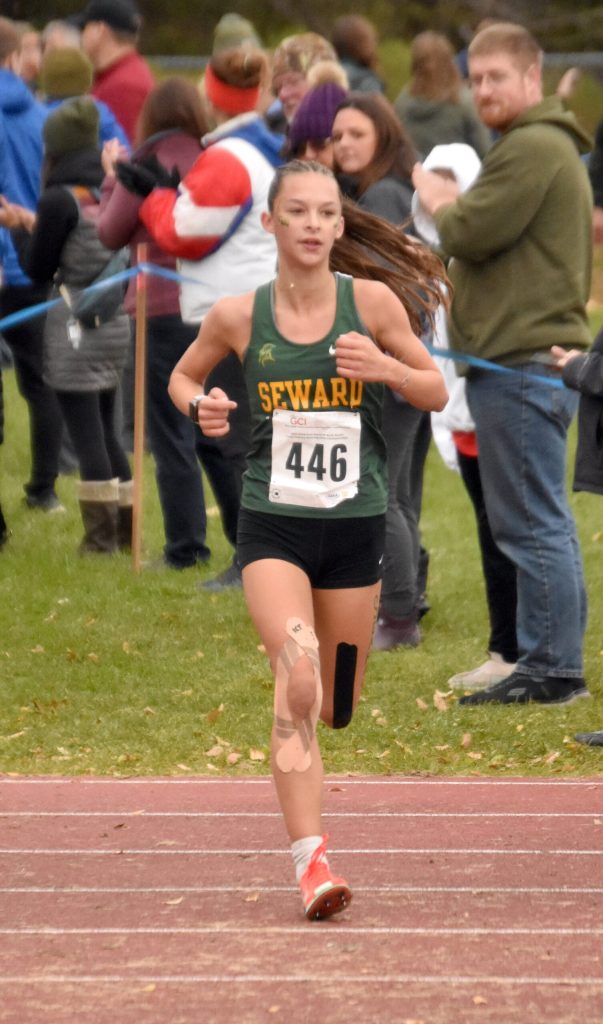 Sewards Olive Jordan finishes third in the Division II girls race at the state cross-country running meet on Saturday, Oct. 5, 2024, at Bartlett High School in Anchorage, Alaska. (Photo by Jeff Helminiak/Peninsula Clarion)