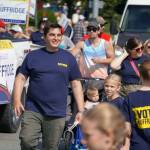 Rep. Justin Ruffridge, R-Soldotna, walks with the 67th Annual Soldotna Progress Days Parade down Binkley Street in Soldotna, Alaska, on Saturday, July 27, 2024. (Jake Dye/Peninsula Clarion)
