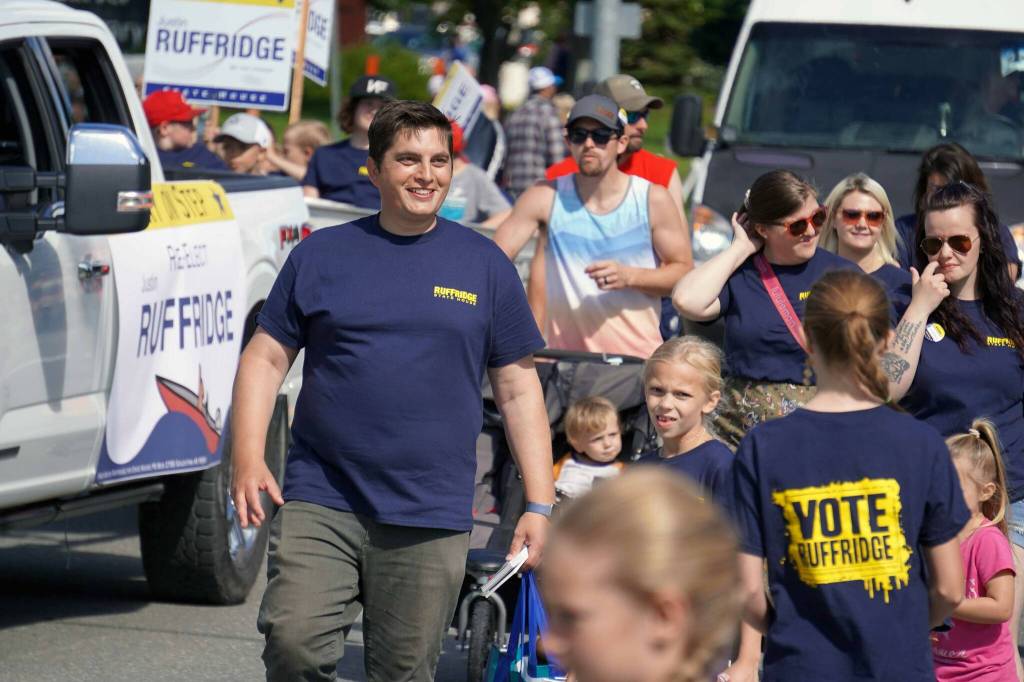 Rep. Justin Ruffridge, R-Soldotna, walks with the 67th Annual Soldotna Progress Days Parade down Binkley Street in Soldotna, Alaska, on Saturday, July 27, 2024. (Jake Dye/Peninsula Clarion)