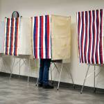 A voter fills out their ballot at the Kenai No. 2 Precinct in the Challenger Learning Center of Alaska in Kenai, Alaska, on Tuesday, Oct. 1, 2024. (Jake Dye/Peninsula Clarion)