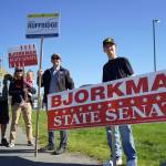 Supporters of Rep. Justin Ruffridge, R-Soldotna, and Sen. Jesse Bjorkman, R-Nikiski, wave signs on the side of the Sterling Highway in Soldotna, Alaska, during the Alaska Primary Election Day on Tuesday, Aug. 20, 2024. (Jake Dye/Peninsula Clarion)