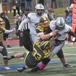 Sewards Jack Gardner and Camden Schrock bring down Nikiskis Ethan Ellis on Friday, Oct. 11, 2024, at Justin Maile Field in Soldotna, Alaska. (Photo by Jeff Helminiak/Peninsula Clarion)