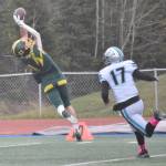 Sewards Hunter Forshee-Kurtz makes a catch for a first down over Nikiskis Ethan Ellis on Friday, Oct. 11, 2024, at Justin Maile Field in Soldotna, Alaska. (Photo by Jeff Helminiak/Peninsula Clarion)
