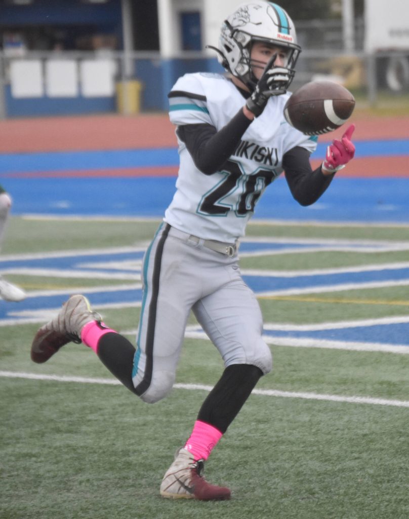 Nikiskis Wyatt Maguire hauls in a touchdown pass Friday, Oct. 11, 2024, at Justin Maile Field in Soldotna, Alaska. (Photo by Jeff Helminiak/Peninsula Clarion)