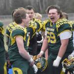 Lane Petersen, Brett Gilmore, Jack Gardner and Noah Price celebrate Seward's victory over Nikiski in the nine-man state championship Friday, Oct. 11, 2024, at Justin Maile Field in Soldotna, Alaska. (Photo by Jeff Helminiak/Peninsula Clarion)