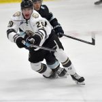 Dario Lass of the Kenai River Brown Bears and Taisetsu Ushio of the Anchorage Wolverines battle for the puck Saturday, Oct. 12, 2024, at the Soldotna Regional Sports Complex in Soldotna, Alaska. (Photo by Jeff Helminiak/Peninsula Clarion)