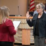 Kenai City Clerk Shelie Saner administers an oath of office to Deborah Sounart during a meeting of the Kenai City Council in Kenai, Alaska, on Wednesday, Oct. 16, 2024. Sounart won reelection to the council during the Oct. 1 municipal election. (Jake Dye/Peninsula Clarion)