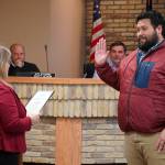 Kenai City Clerk Shelie Saner administers an oath of office to Sovala Kisena during a meeting of the Kenai City Council in Kenai, Alaska, on Wednesday, Oct. 16, 2024. Kisena won election to the council during the Oct. 1 municipal election. (Jake Dye/Peninsula Clarion)