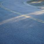 Fresh pavement stretches along Lilac Lane in Kenai, Alaska, on Friday, Oct. 18, 2024. (Jake Dye/Peninsula Clarion)