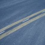 Fresh pavement stretches along Lilac Lane in Kenai, Alaska, on Friday, Oct. 18, 2024. (Jake Dye/Peninsula Clarion)