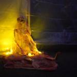 A skeleton wrapped in cobwebs rests on the floor of the Haunted Chamber at the Kenai Chamber of Commerce and Visitor Center in Kenai, Alaska, on Friday, Oct. 18, 2024. (Jake Dye/Peninsula Clarion)