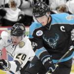 Cashen Naeve of the Wisconsin Windigo protects the puck from Dario Lass of the Kenai River Brown Bears on Friday, Oct. 18, 2024, at the Soldotna Regional Sports Complex in Soldotna, Alaska. (Photo by Jeff Helminiak/Peninsula Clarion)
