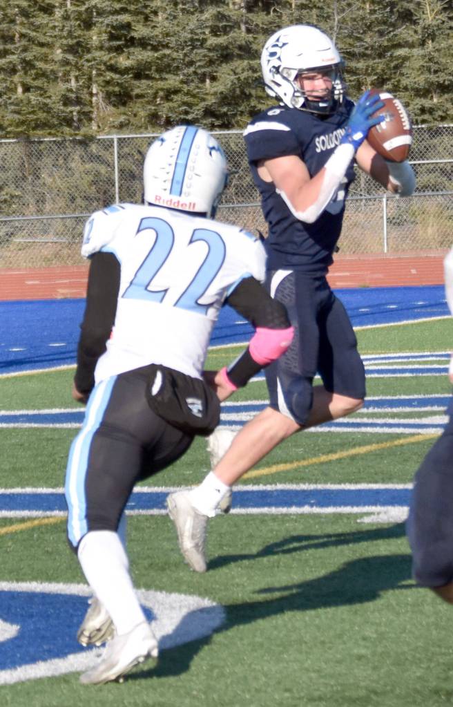 Soldotnas Trevor Michael catches a touchdown pass in front of Chugiaks Makai Warren-Dowl in the Division II semifinal Saturday, Oct. 19, 2024, at Justin Maile Field at Soldotna High School in Soldotna, Alaska. (Photo by Jeff Helminiak/Peninsula Clarion)