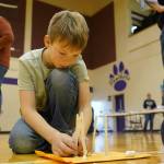 Teams assemble towers during the Spontaneous Challenge portion of the Mind-A-Mazes competition at Skyview Middle School near Soldotna, Alaska, on Saturday, Oct. 19, 2024. (Jake Dye/Peninsula Clarion)