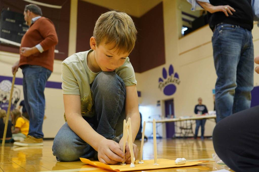 Teams assemble towers during the Spontaneous Challenge portion of the Mind-A-Mazes competition at Skyview Middle School near Soldotna, Alaska, on Saturday, Oct. 19, 2024. (Jake Dye/Peninsula Clarion)