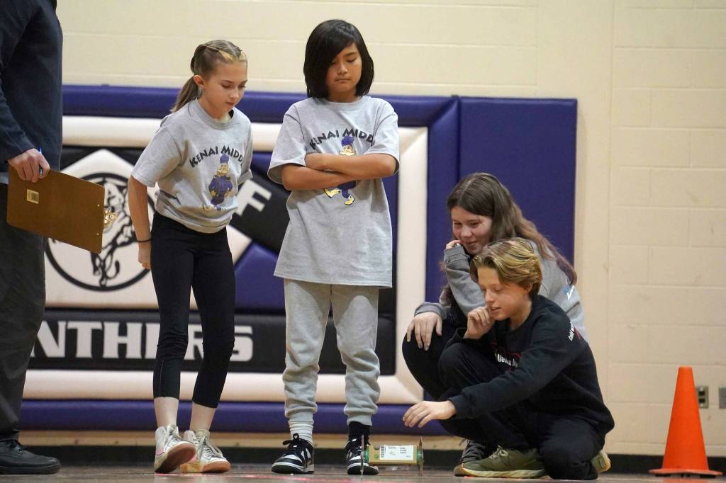 The Peachy Peaches deploy their machine during the Mind-A-Mazes competition at Skyview Middle School near Soldotna, Alaska, on Saturday, Oct. 19, 2024. (Jake Dye/Peninsula Clarion)