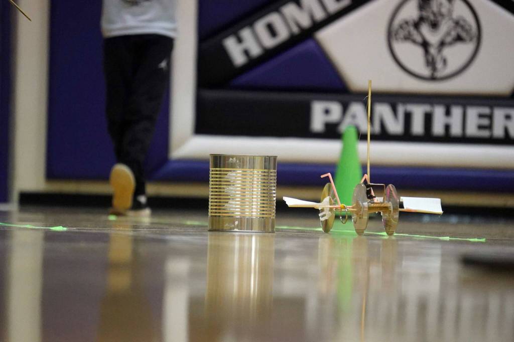 A machine rolls across the gym floor during the Mind-A-Mazes competition at Skyview Middle School near Soldotna, Alaska, on Saturday, Oct. 19, 2024. (Jake Dye/Peninsula Clarion)