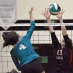 Nikiskis Alexa Iyatunguk attacks against Kenai Centrals Ellsi Miller on Tuesday, Oct. 22, 2024, at Nikiski Middle-High School in Nikiski, Alaska. (Photo by Jeff Helminiak/Peninsula Clarion)