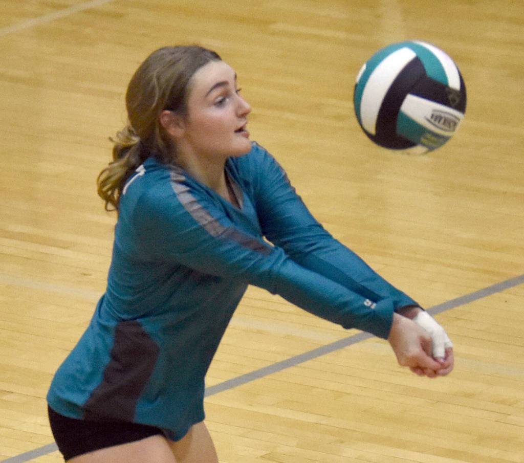 Nikiskis Evelyn Reichert digs up a ball against Kenai Central on Tuesday, Oct. 22, 2024, at Nikiski Middle-High School in Nikiski, Alaska. (Photo by Jeff Helminiak/Peninsula Clarion)