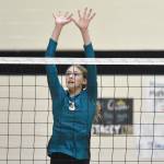 Kenai Centrals Stella Selanoff attacks against Nikiskis Blakeley Jorgensen and Mandee Roofe on Tuesday, Oct. 22, 2024, at Nikiski Middle-High School in Nikiski, Alaska. (Photo by Jeff Helminiak/Peninsula Clarion)