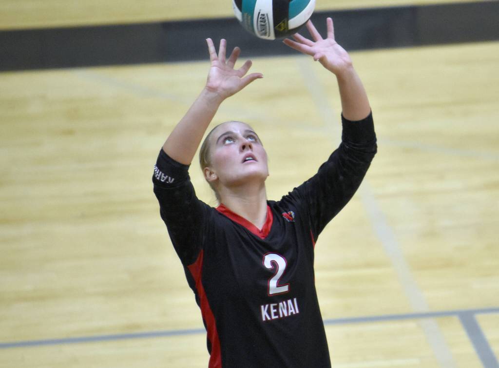 Kenai Centrals Kate Wisnewski sets against Nikiski on Tuesday, Oct. 22, 2024, at Nikiski Middle-High School in Nikiski, Alaska. (Photo by Jeff Helminiak/Peninsula Clarion)