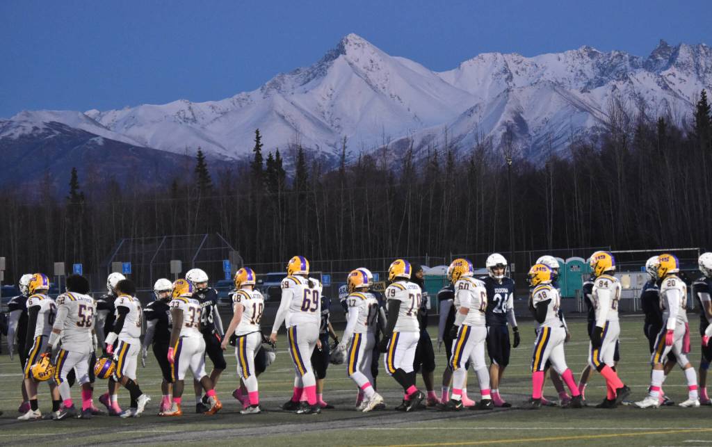 Lathrop and Soldotna shake hands on Saturday, Oct. 26, 2024, at the First National Bowl Division II title game at Pride Field at Colony High School in Palmer, Alaska. (Photo by Jeff Helminiak/Peninsula Clarion)