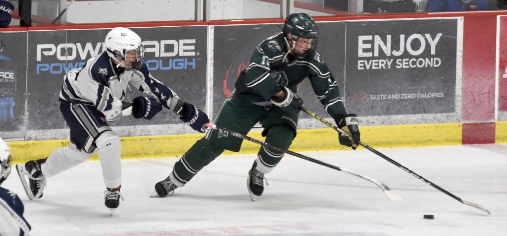 Soldotnas Chase Willis and Colonys Myles Diltz battle for the puck Thursday, Oct. 31, 2024, at the Soldotna Regional Sports Complex in Soldotna, Alaska. (Photo by Jonas Oyoumick/For the Clarion)