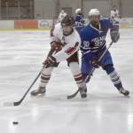 Kenai Centrals Everett Chamberlain and Palmers Kaleb Von Gunten battle for the puck during the Peninsula Ice Challenge on Thursday, Oct. 31, 2024, at the Kenai Multi-Purpose Facility in Kenai, Alaska. (Photo by Jeff Helminiak/Peninsula Clarion)