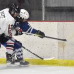 Kenai Centrals Will Howard and Palmers Liam Hilscher battle for the puck during the Peninsula Ice Challenge on Thursday, Oct. 31, 2024, at the Kenai Multi-Purpose Facility in Kenai, Alaska. (Photo by Jeff Helminiak/Peninsula Clarion)
