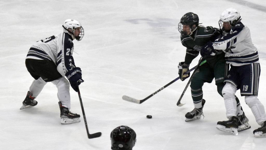 Soldotnas Keegan Myrick and Marshall DeRaeve defend Colonys Logan Lofland on Thursday, Oct. 31, 2024, at the Soldotna Regional Sports Complex in Soldotna, Alaska. (Photo by Jonas Oyoumick/For the Clarion)