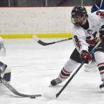 Kenai Central's Logan Mese scores on Palmer's Mily Christman during the Peninsula Ice Challenge on Thursday, Oct. 31, 2024, at the Kenai Multi-Purpose Facility in Kenai, Alaska. (Photo by Jeff Helminiak/Peninsula Clarion)