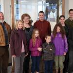 Sen. Lisa Murkowski, second from left, stands for a photo with the Burke family at the Kenai Municipal Airport in Kenai, Alaska, on Friday, Nov. 1, 2024. (Jake Dye/Peninsula Clarion)