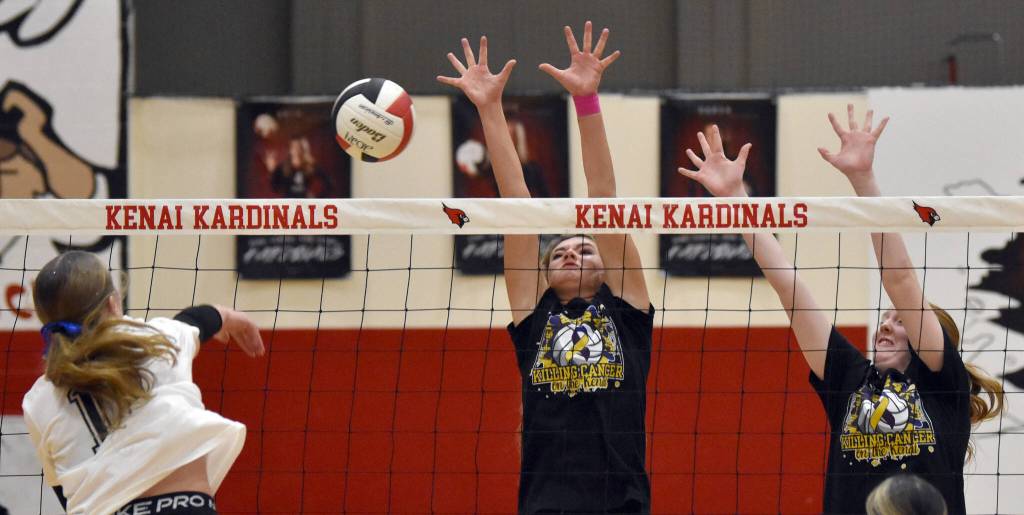 Soldotna's Sadie Lane attacks against Kenai Central's Sophie Tapley and Ellsi Miller on Friday, Nov. 1, 2024, at Kenai Central High School in Kenai, Alaska. (Photo by Jeff Helminiak/Peninsula Clarion)
