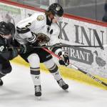 Jackson Ebbott of the Kenai River Brown Bears keeps the puck from Zach Homer of the Minnesota Wilderness on Saturday, Nov. 2, 2024, at the Soldotna Regional Sports Complex in Soldotna, Alaska. (Photo by Jeff Helminiak/Peninsula Clarion)