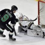 Kenai River Brown Bears goalie Mitchell Mccusker makes a save on Gavin Middendorf of the Chippewa (Wisconsin) Steel on Thursday, Nov. 7, 2024, at the Soldotna Regional Sports Complex in Soldotna, Alaska. (Photo by Jeff Helminiak/Peninsula Clarion)